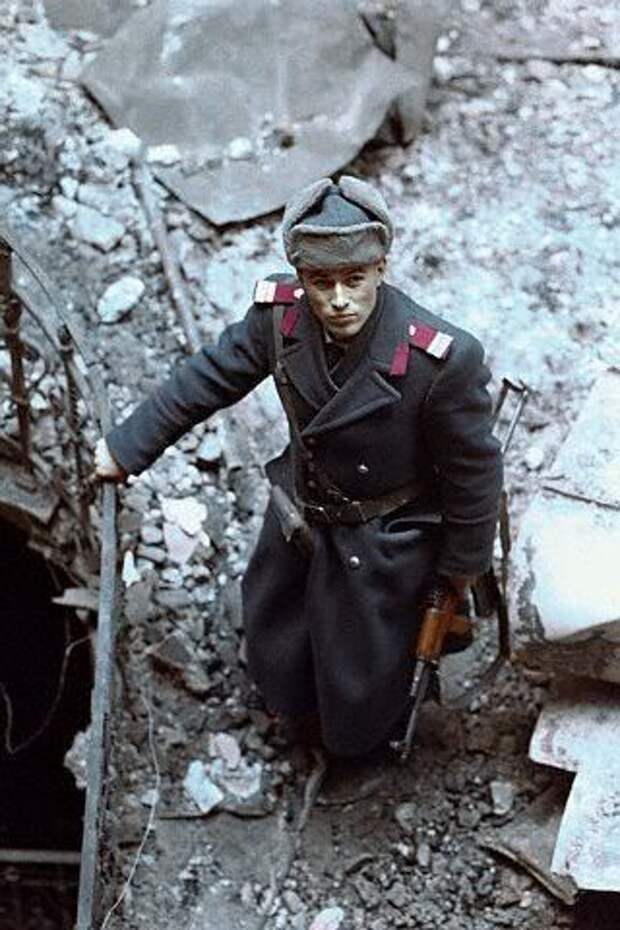 30-RomanianOfficerStandinginRubble.jpg 30-RomanianOfficerStandinginRubble.jpg