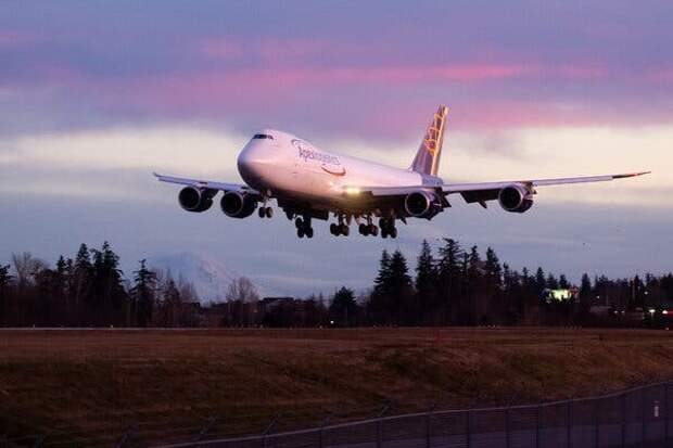 The last 747 landing in the evening after a test flight. The sky has a purple tint.