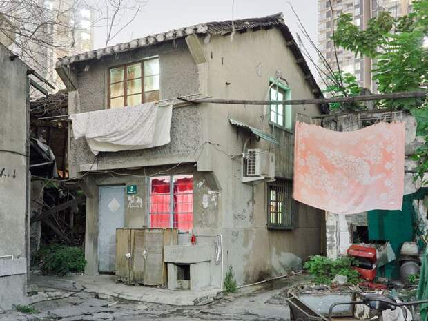 Трущобы упрямых китайцев, отказывающихся переселяться в квартиры (23 фото)