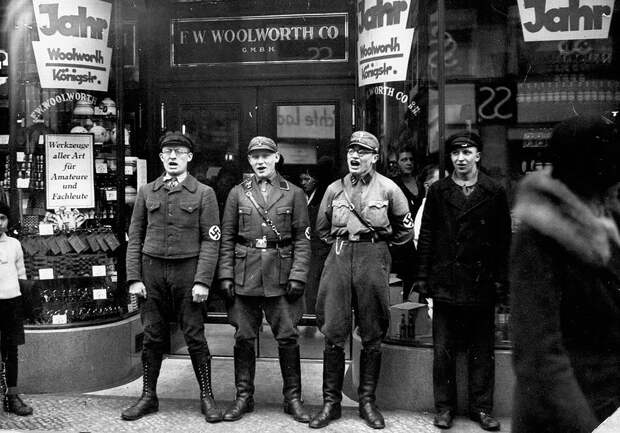 Nazis singing to encourage a boycott of Jewish shops , 1933