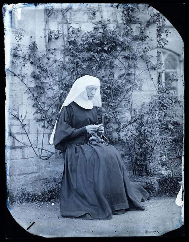 Early image of a nun knitting, ca. no later than 1890.