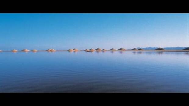 string of cones on water horizon