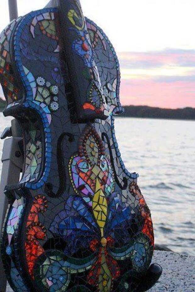 Recycled musical instument finished off in mosaics.....Beautiful.