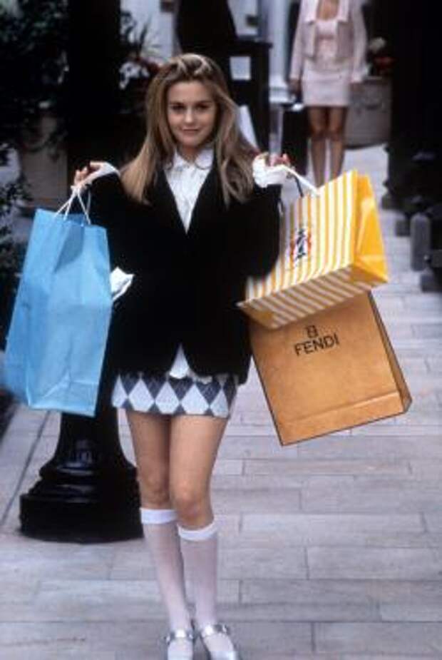 Alicia Silverstone holding shopping bags in a scene from the film 'Clueless'