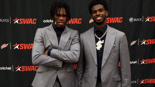 Teammates Travis Hunter and Shedeur Sanders pose for a photo.