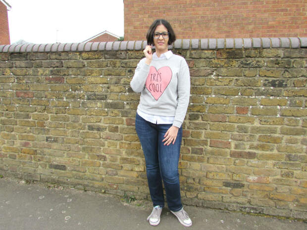 A slogan sweater worn in a casual way
