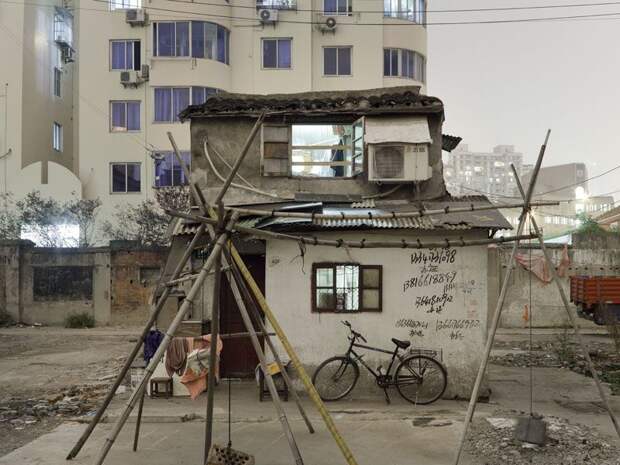 Трущобы упрямых китайцев, отказывающихся переселяться в квартиры (23 фото)