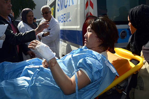 A victim arrives at the Charles Nicoles hospital, Wednesday, March 18, 2015 in Tunis, Tunisia. Authorities say scores of people are dead after an attack on a major museum in the Tunisian capital, and some of the gunmen may have escaped. (AP Photo/Edel Ezine)