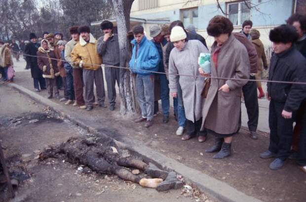 Romanians Looking at Burnt Corpse Romanians Looking at Burnt Corpse