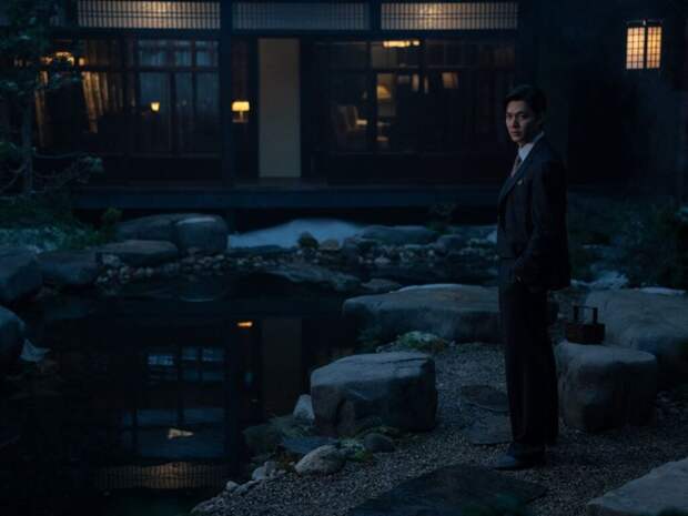 Koh Hansu stands in his garden