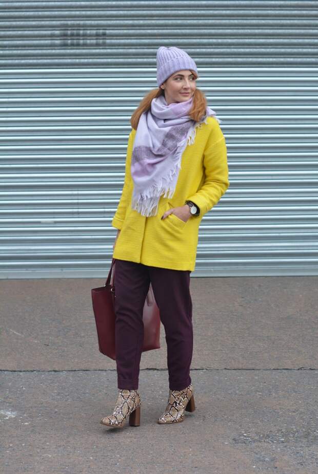 Bright winter outfit | Yellow coat, purple trousers, lilac scarf & hat, snakeskin boots