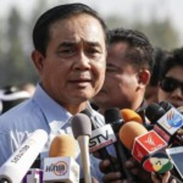 Chan-ocha answers questions from the media while attending national Children's Day at The Army base in central Bangkok