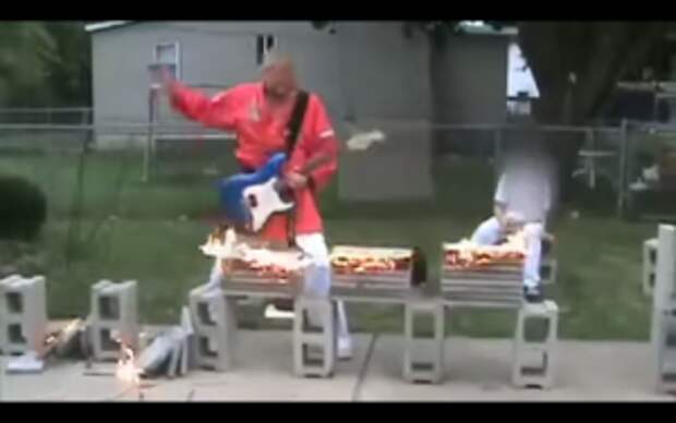 This Guy Multitasks Playing Guitar and Karate Chopping Bricks … But That’s Not All.