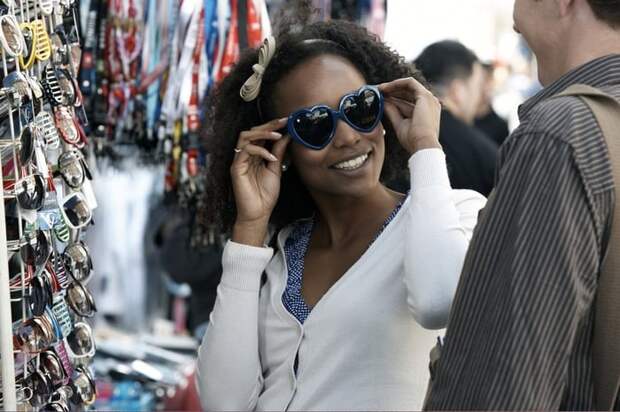 Woman shopping for sunglasses