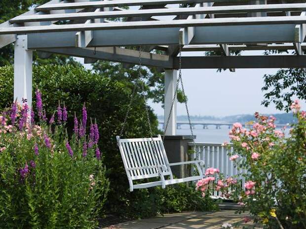 Arbor with Swing Seat Enhances Outdoor Setting