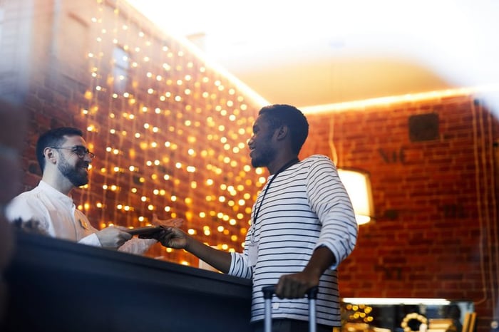 A man checking in to a hotel.