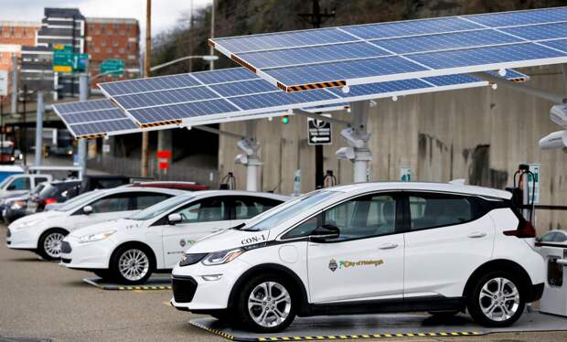 vehicles at solar powered charging station