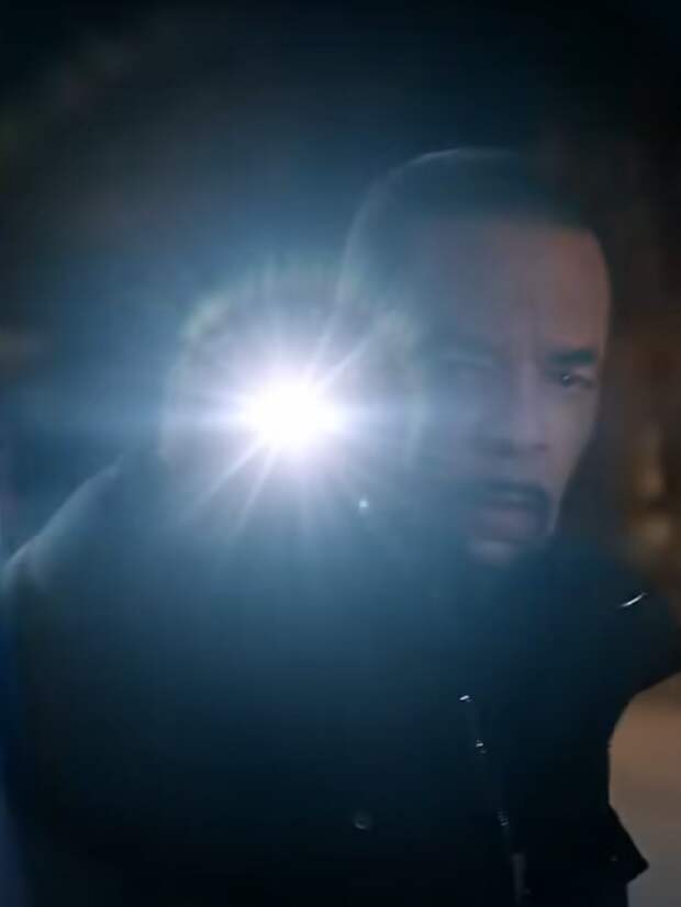Fin shining a flashlight on a darkened scene on Law & Order: SVU Season 26 Episode 1
