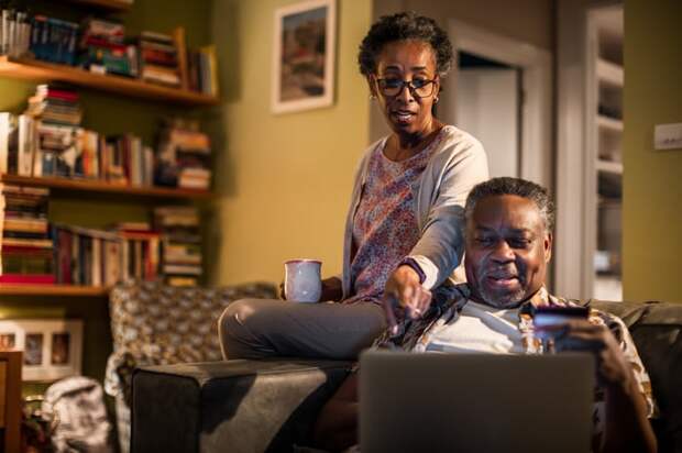 Two adults looking at financial paperwork.