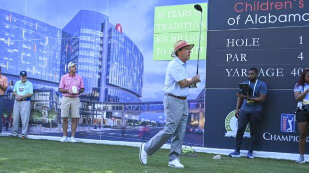 Nick Saban tees off at a charity golf event in Birmingham, AL.