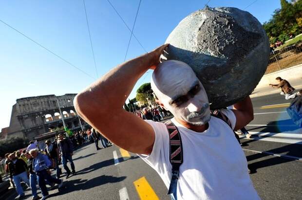A protester carries a handmade globe on