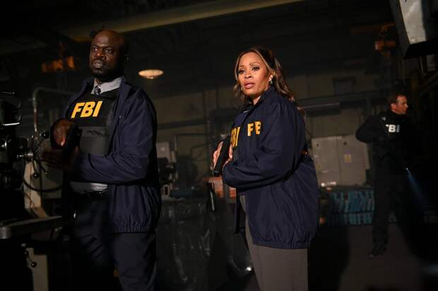 Marisa and another agent looking shocked while holding a gun at an FBI raid on The Irrational Season 2