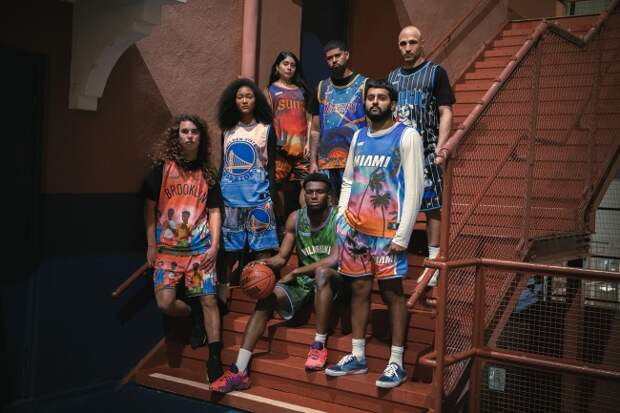 Photo of seven people wearing KidSuper's new and playfully designed NBA Jerseys for the following teams: The Brooklyn Nets, Golden State Warriors, Phoenix Suns, Los Angeles Lakers, Orlando Magic, Milwaukee Bucks, and Miami Heat