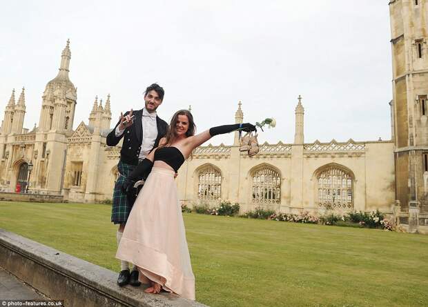 Getting into the party spirits: Guests kick off their heels as the sun comes up following a night of partying in Cambridge