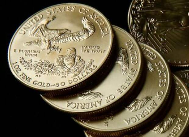 Gold U.S. dollar bullion coins are seen in this photo illustration taken in Moscow, Russia August 4, 2017. Picture taken August 4, 2017. REUTERS/Maxim Shemetov/Illustration