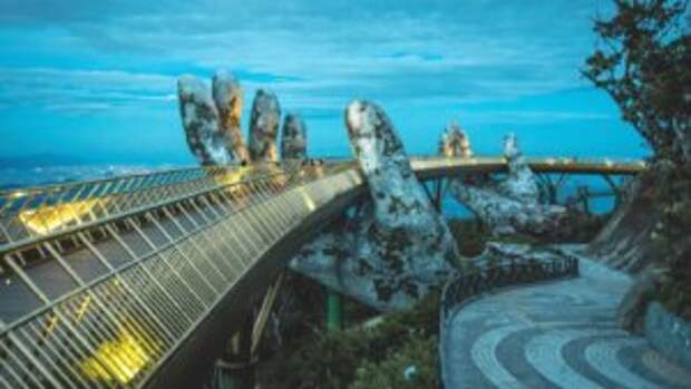 solarpunk stone hands golden bridge vietnam dusk trees
