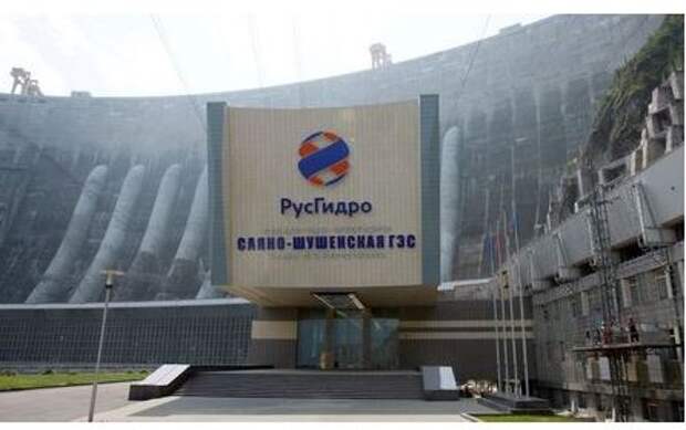 A logo of the RusHydro company, that operates the Russia's largest hydroelectric power station, Sayano-Shushenskaya, is seen above an entrance of the station, near the Siberian village of Cheryomushki, in the Republic of Khakassia, Russia July 22, 2019. Picture taken July 22, 2019. REUTERS/Ilya Naymushin