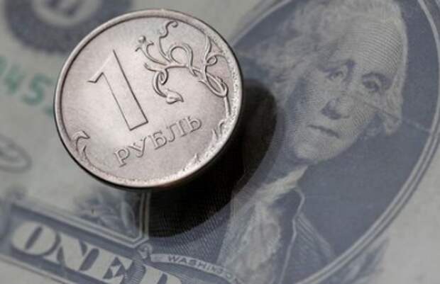 A view shows a Russian rouble coin and a U.S. dollar banknote in this picture illustration taken October 26, 2018. Picture taken October 26, 2018. REUTERS/Maxim Shemetov
