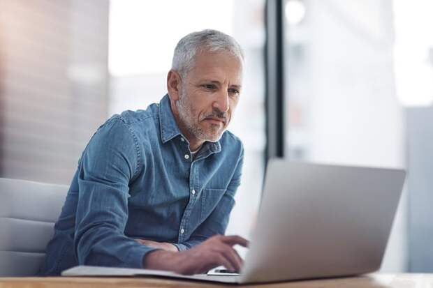 Man looking at laptop.