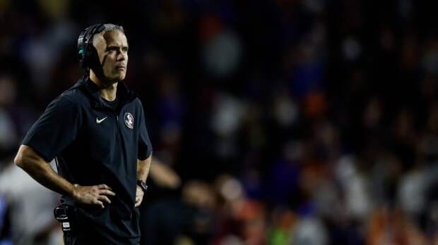 Mike Norvell watches from the sidelines during a Florida State football game.