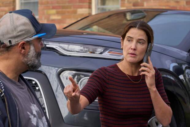 Val tries to keep her car from getting towed.
