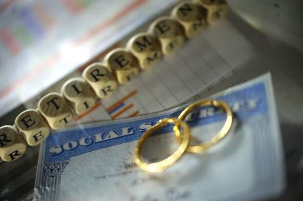 Two wedding rings sitting on a Social Security card.
