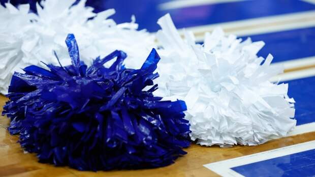 cheerleader pom poms on basketball court