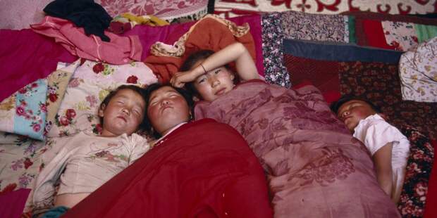 Kazakh children asleep in their kigizuy tent made