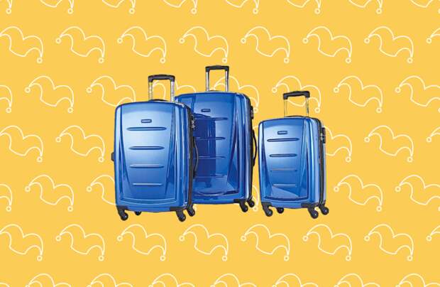 Three blue rolling suitcases against a yellow background