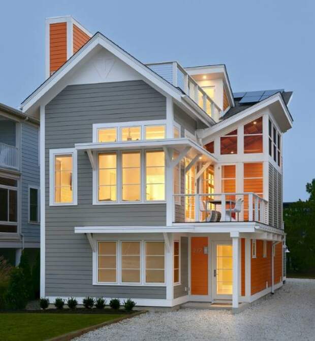 Серый и оранжевый - интересное сочетание цветов фасада дома Современный фасад частного дома в сером и оранжевом цвете