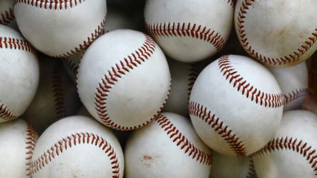 A basket full of baseballs.