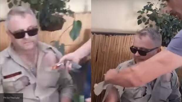 Украинские националисты изрезали рубашку прямо на человеке из-за символики России