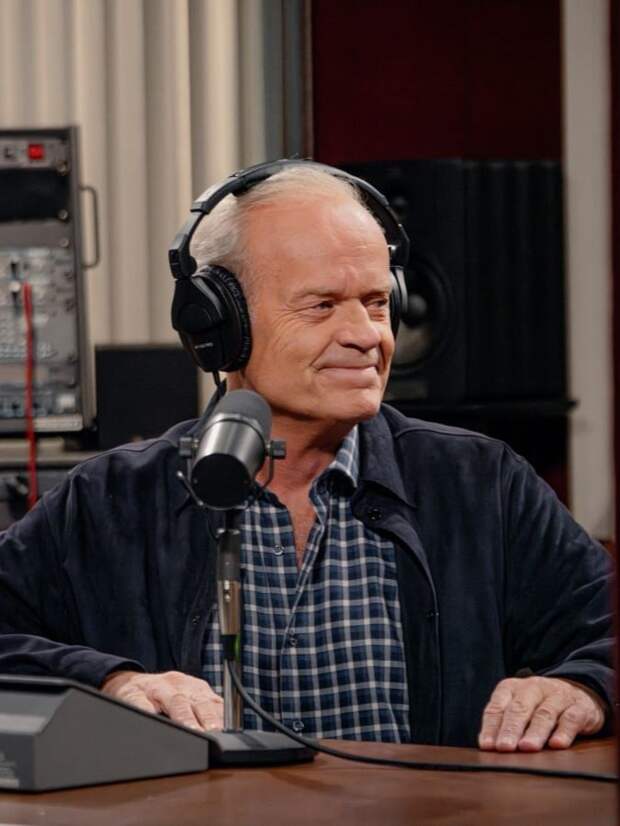 Frasier sits at his old radio microphone and smiles