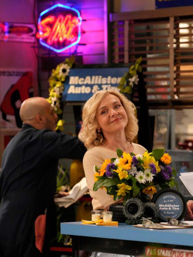 Audrey smiling after putting flowers in the shop on Georgie & Mandy's First Marriage Season 1 Episode 13