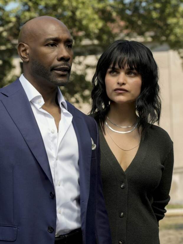 Morris Chestnut as Dr. John Watson and Eve Harlow as Dr. Ingrid Derian